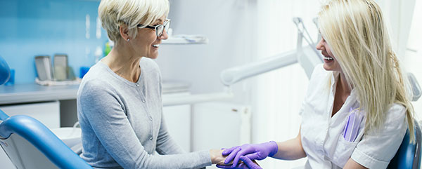 A patient and a dentist interacting.