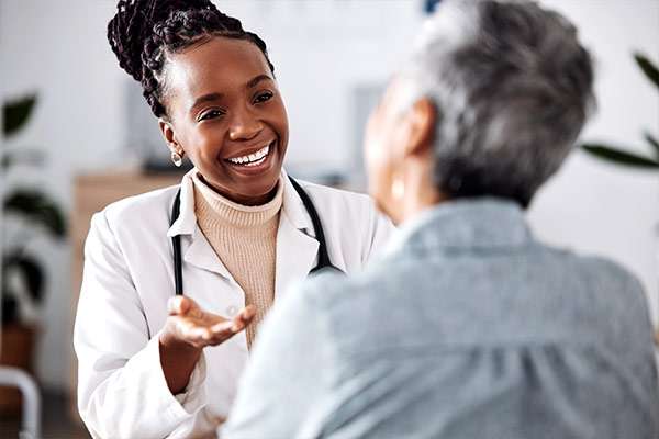 A medical professional casually talking with a patient